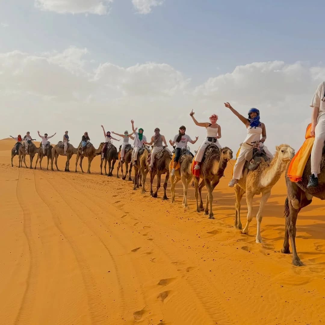 Morocco camel ride across Erg Chebbi during a five day Marrakech desert tour