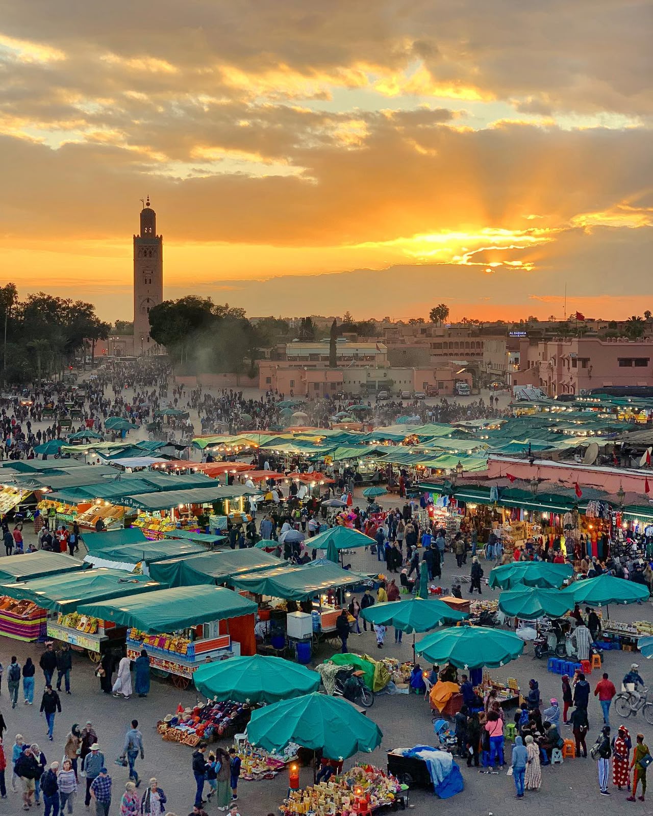 Jemaa el-Fna square in Marrakech with traditional Moroccan souks and architecture | tours marrakech desert