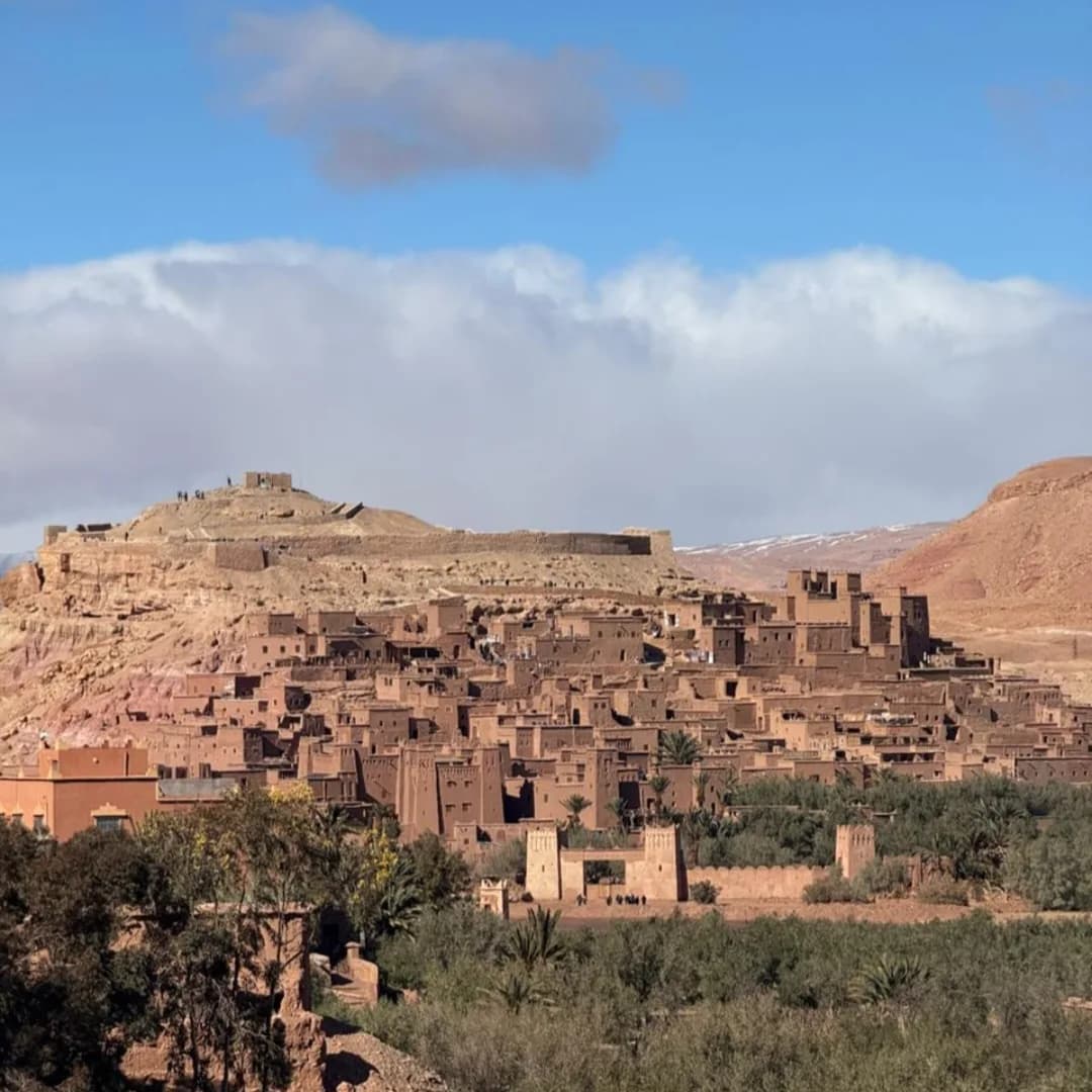 Ait Ben Haddou ksar near Ouarzazate Morocco with earthen towers and High Atlas landscape